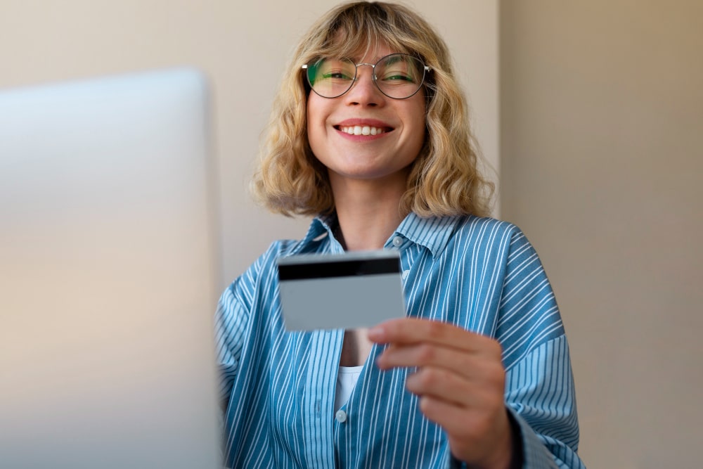 Woman smiling while using laptop